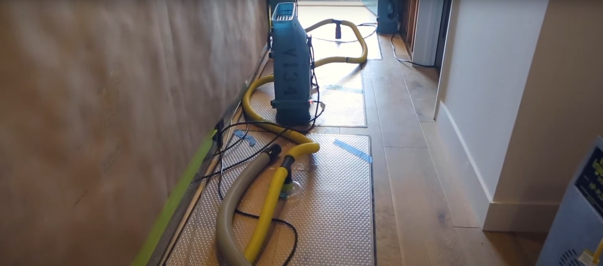 Advanced water damage restoration equipment and technology Professional water damage restoration equipment including industrial fans and dehumidifiers in action